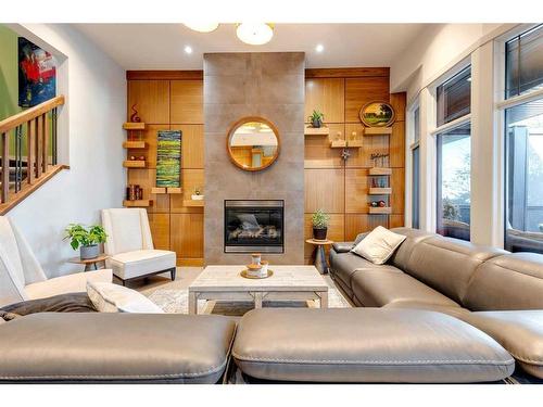145 Chapala Point Se, Calgary, AB - Indoor Photo Showing Living Room With Fireplace