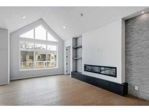 802 Mandalay Link, Carstairs, AB - Indoor Photo Showing Living Room With Fireplace