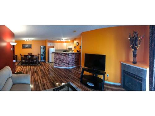 4214-4975 130 Avenue Se, Calgary, AB - Indoor Photo Showing Living Room With Fireplace