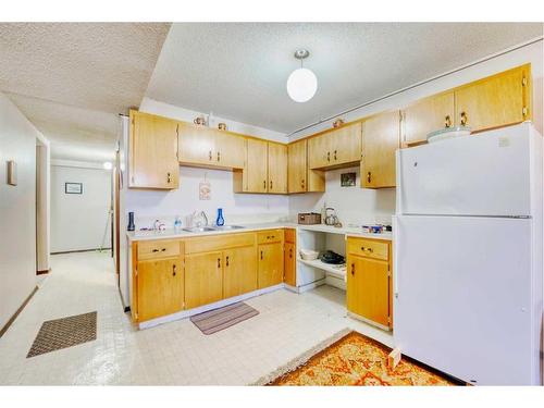 210, 212 31 Avenue Ne, Calgary, AB - Indoor Photo Showing Kitchen With Double Sink
