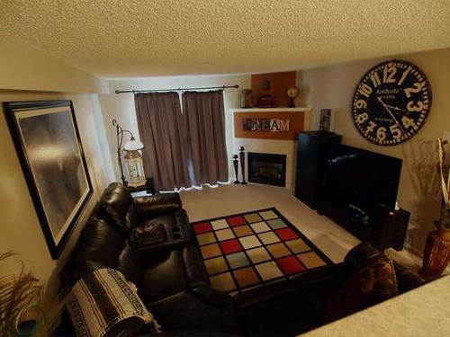1221-4975 130 Avenue Se, Calgary, AB - Indoor With Fireplace