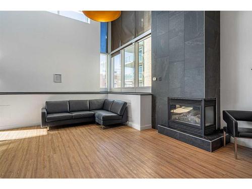 2306-1410 1 Street Se, Calgary, AB - Indoor With Fireplace