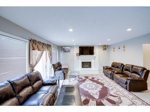63 Whiteram Court Ne, Calgary, AB - Indoor Photo Showing Living Room With Fireplace