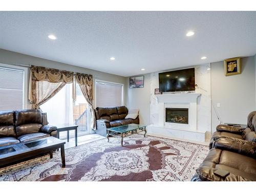 63 Whiteram Court Ne, Calgary, AB - Indoor Photo Showing Living Room With Fireplace