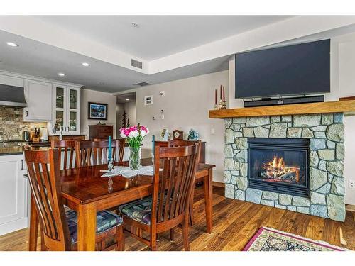 303-905 Spring Creek Drive, Canmore, AB - Indoor With Fireplace
