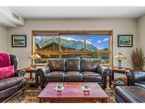 303-905 Spring Creek Drive, Canmore, AB - Indoor Photo Showing Living Room
