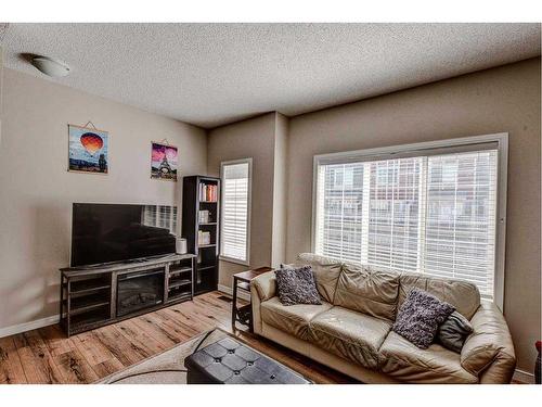 124 Marquis Lane Se, Calgary, AB - Indoor Photo Showing Living Room