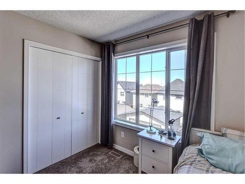 124 Marquis Lane Se, Calgary, AB - Indoor Photo Showing Bedroom