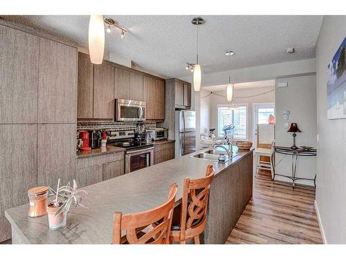 124 Marquis Lane Se, Calgary, AB - Indoor Photo Showing Kitchen With Double Sink With Upgraded Kitchen