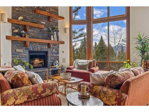 23 Juniper Ridge, Canmore, AB - Indoor Photo Showing Living Room With Fireplace