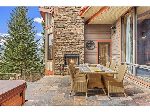 23 Juniper Ridge, Canmore, AB - Outdoor With Fireplace With Deck Patio Veranda With Exterior