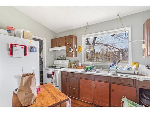 2619 & 2621 12 Avenue Se, Calgary, AB - Indoor Photo Showing Kitchen With Double Sink