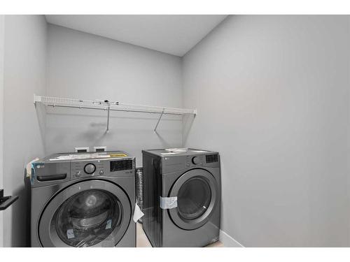 168 Arbour Lake Hill Nw, Calgary, AB - Indoor Photo Showing Laundry Room