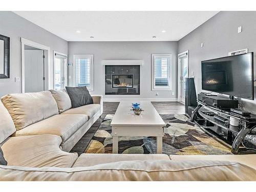 145 Silverado Crest Landing Sw, Calgary, AB - Indoor Photo Showing Living Room With Fireplace