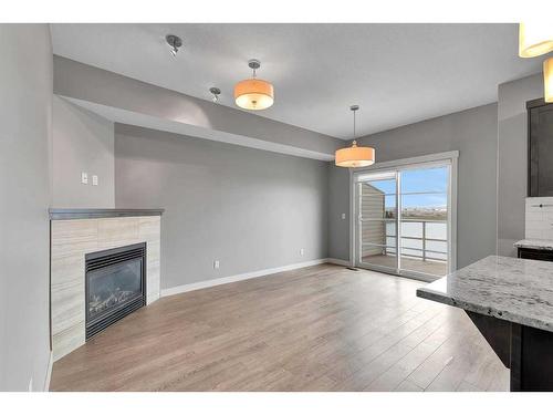 540 Redstone View Ne, Calgary, AB - Indoor Photo Showing Living Room With Fireplace