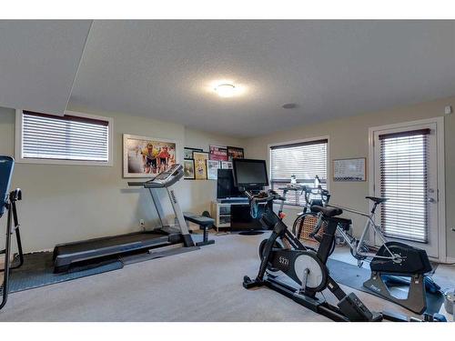 144 Westland Street, Okotoks, AB - Indoor Photo Showing Gym Room
