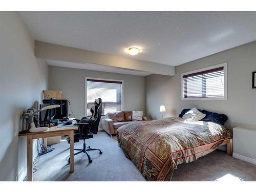 144 Westland Street, Okotoks, AB - Indoor Photo Showing Bedroom