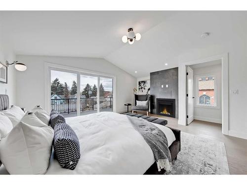 1407 10 Avenue Se, Calgary, AB - Indoor Photo Showing Bedroom With Fireplace