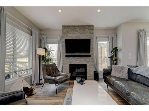 4-2424 30 Street Sw, Calgary, AB - Indoor Photo Showing Living Room With Fireplace