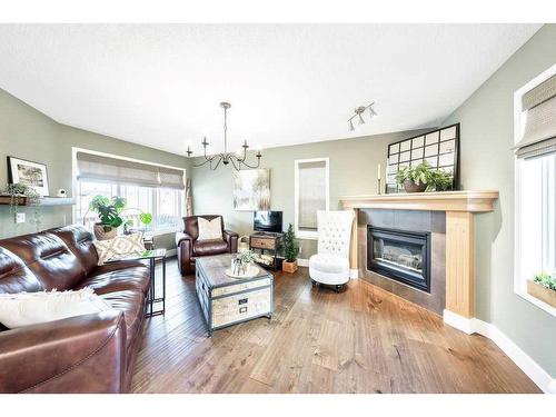 245 Inverness Park Se, Calgary, AB - Indoor Photo Showing Living Room With Fireplace