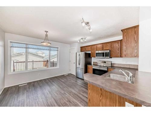 2465 Sagewood Crescent Sw, Airdrie, AB - Indoor Photo Showing Kitchen With Double Sink