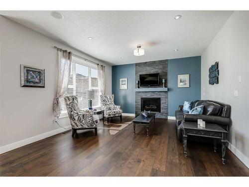 1400 Price Road, Carstairs, AB - Indoor Photo Showing Living Room With Fireplace