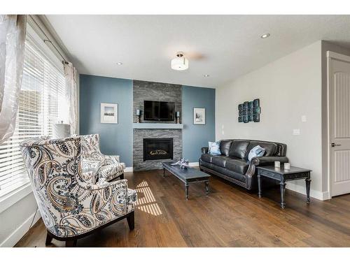 1400 Price Road, Carstairs, AB - Indoor Photo Showing Living Room With Fireplace