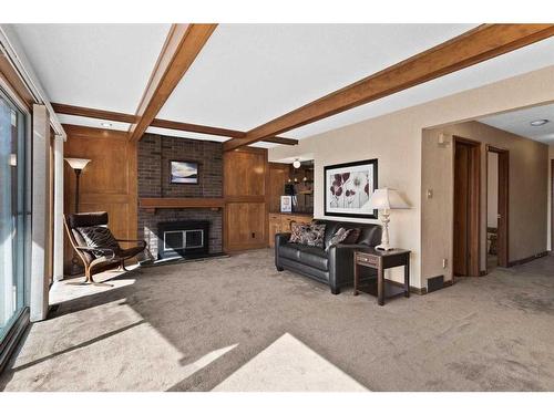 37 Strabane Place Sw, Calgary, AB - Indoor With Fireplace