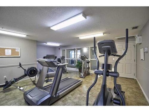 103-15 Everstone Drive Sw, Calgary, AB - Indoor Photo Showing Gym Room
