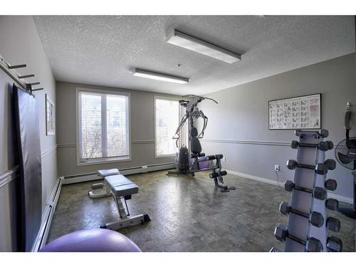 103-15 Everstone Drive Sw, Calgary, AB - Indoor Photo Showing Gym Room