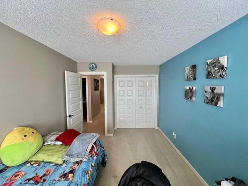 1603 Monteith Drive Se, High River, AB - Indoor Photo Showing Bedroom