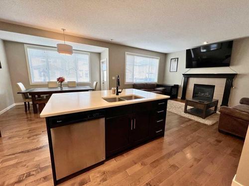1603 Monteith Drive Se, High River, AB - Indoor Photo Showing Other Room With Fireplace