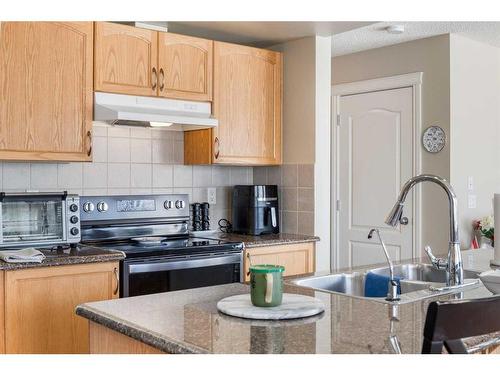 404 Rainbow Falls Way, Chestermere, AB - Indoor Photo Showing Kitchen With Double Sink