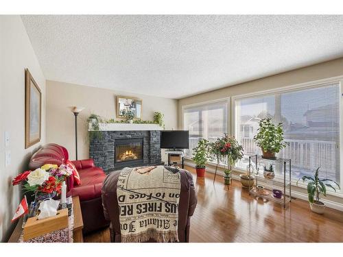 404 Rainbow Falls Way, Chestermere, AB - Indoor Photo Showing Living Room With Fireplace