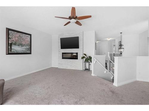 110 Cranleigh Way Se, Calgary, AB - Indoor With Fireplace