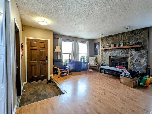 5907 58 Street, Olds, AB - Indoor Photo Showing Other Room With Fireplace