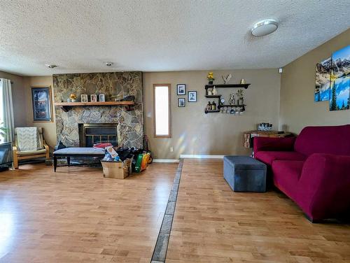 5907 58 Street, Olds, AB - Indoor Photo Showing Living Room With Fireplace
