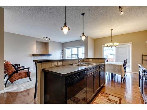 321 Bridleridge View Sw, Calgary, AB - Indoor Photo Showing Kitchen With Double Sink