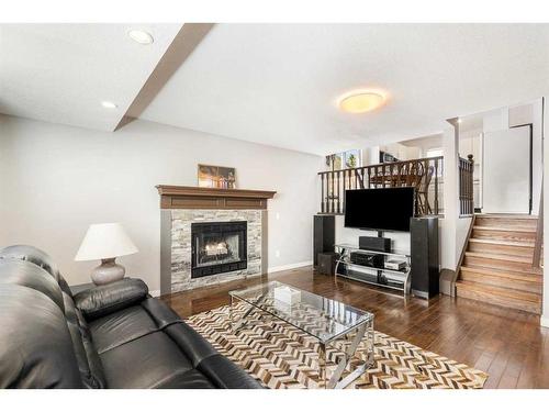 245 Sandstone Drive Nw, Calgary, AB - Indoor Photo Showing Living Room With Fireplace