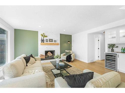 192 Canterville Drive Sw, Calgary, AB - Indoor Photo Showing Living Room With Fireplace