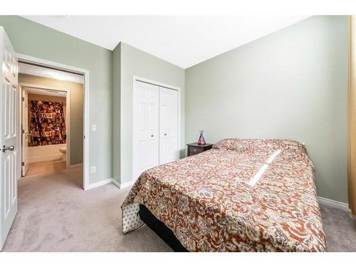 67 Buckskin Way, Cochrane, AB - Indoor Photo Showing Bedroom