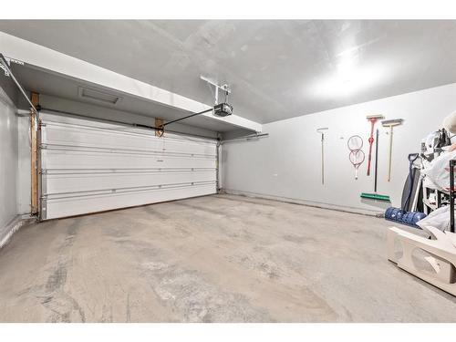 67 Buckskin Way, Cochrane, AB - Indoor Photo Showing Garage
