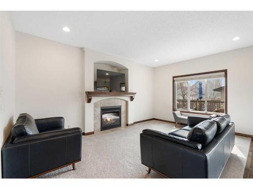 333 Mckenzie Towne Drive Se, Calgary, AB - Indoor Photo Showing Living Room With Fireplace