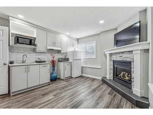 433 Stonegate Way Nw, Airdrie, AB - Indoor With Fireplace