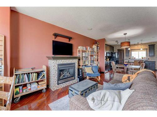 288 Rainbow Falls Drive, Chestermere, AB - Indoor Photo Showing Living Room With Fireplace