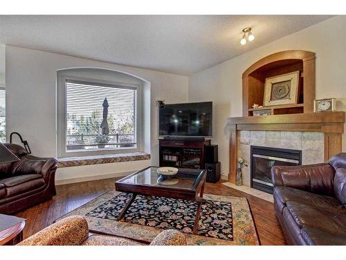 50 Elgin Park Road Se, Calgary, AB - Indoor Photo Showing Living Room With Fireplace