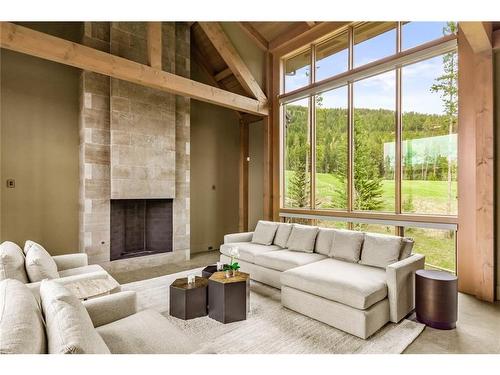 600 Silvertip Road, Canmore, AB - Indoor Photo Showing Living Room With Fireplace