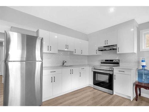 162 Bayview Circle Sw, Airdrie, AB - Indoor Photo Showing Kitchen With Stainless Steel Kitchen With Upgraded Kitchen