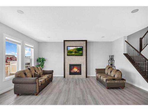 162 Bayview Circle Sw, Airdrie, AB - Indoor Photo Showing Living Room With Fireplace