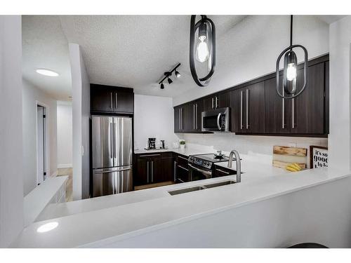 405-225 25 Avenue Sw, Calgary, AB - Indoor Photo Showing Kitchen With Stainless Steel Kitchen With Double Sink
